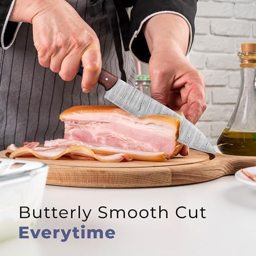 Chef slicing meat with pakka wood handle Damascus knife on cutting board