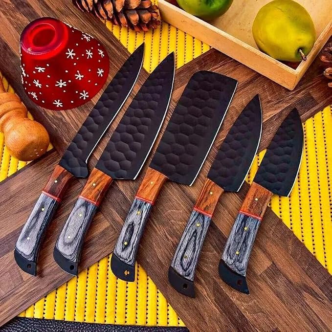 5 knives with black hammered blades fanned on wood board with props