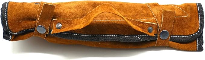 Closed rust suede roll case with black trim and snap buttons