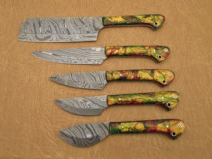 Close up of 5 piece Damascus steel knife set with multicolor acrylic handles and nickel pins