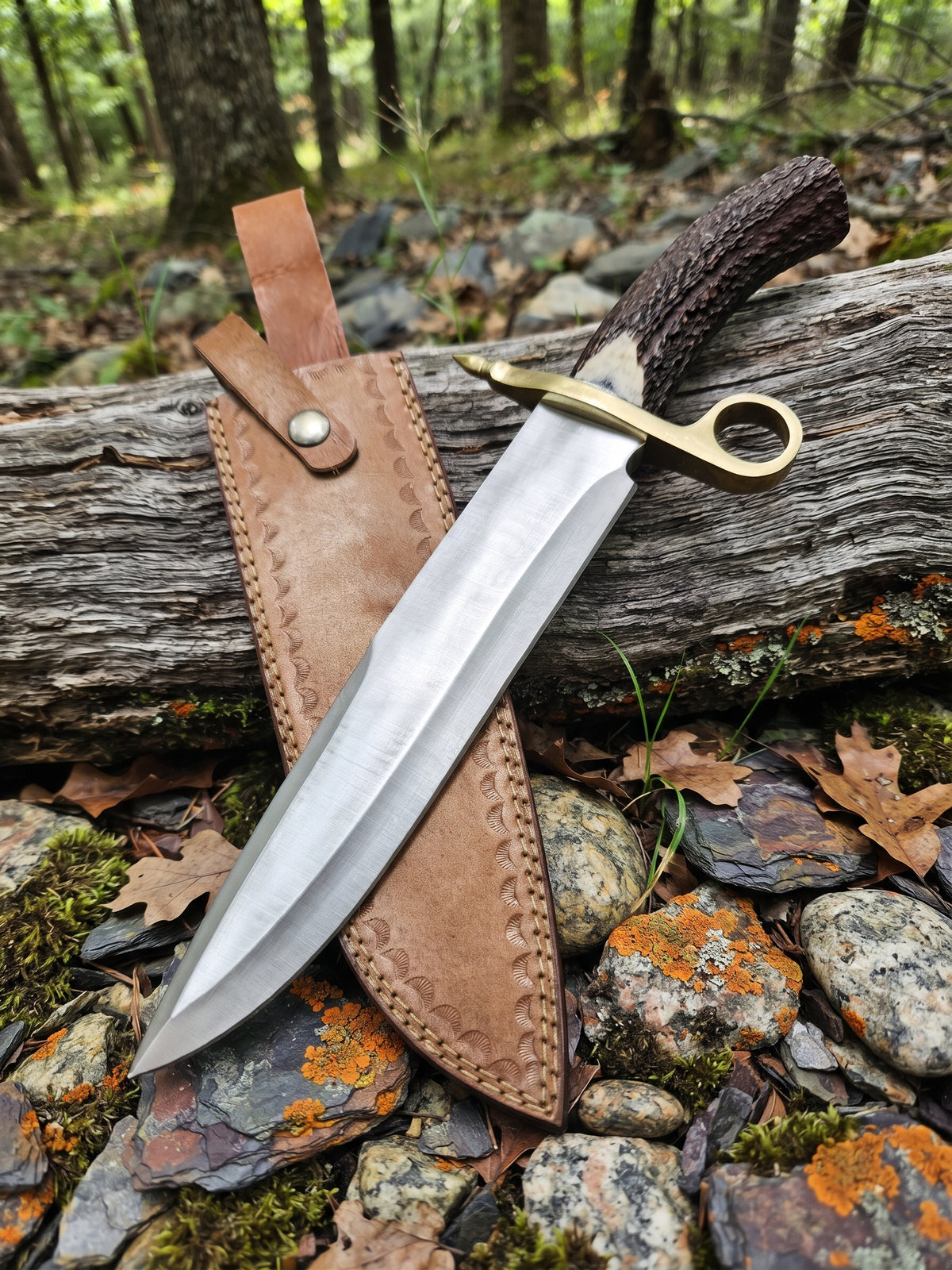 Closeup of stainless steel Bowie knife clip point blade