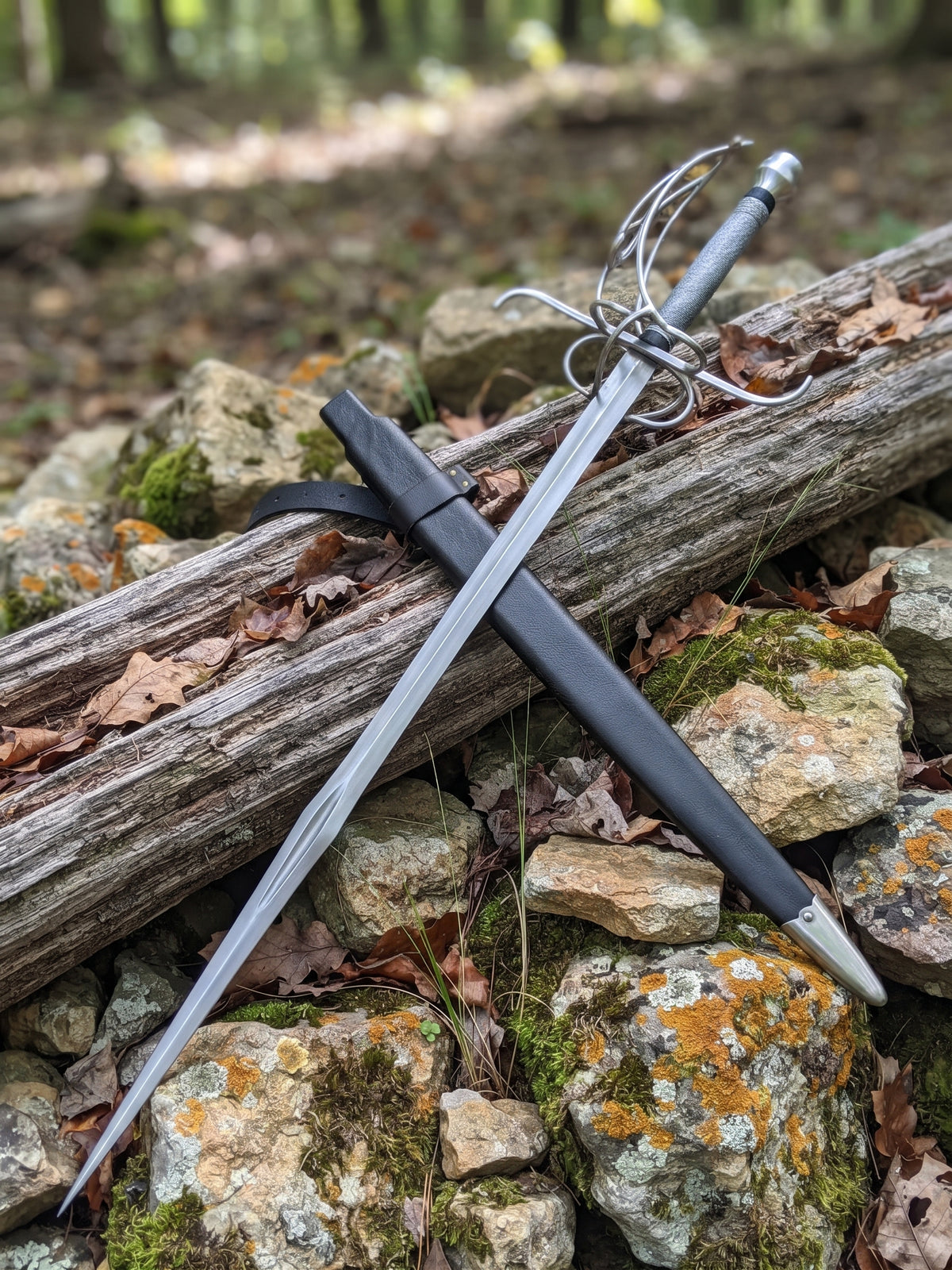 Closeup of carbon steel rapier blade showing lengthwise central groove