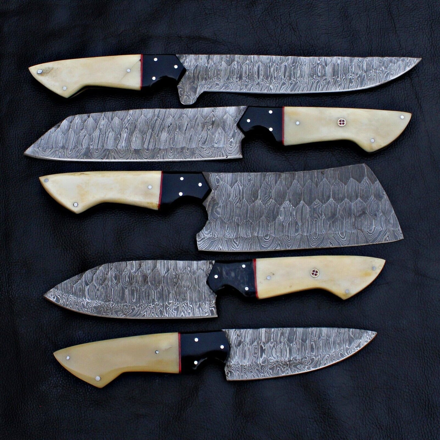 Detail view of the robust full tang construction on a Spark Knives Damascus steel knife.