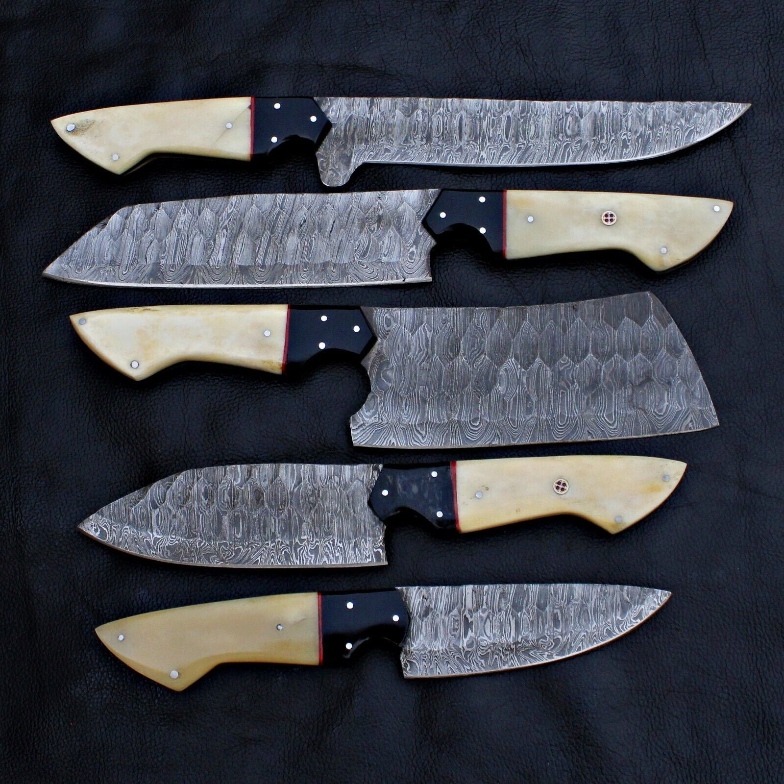 Detail view of the robust full tang construction on a Spark Knives Damascus steel knife.