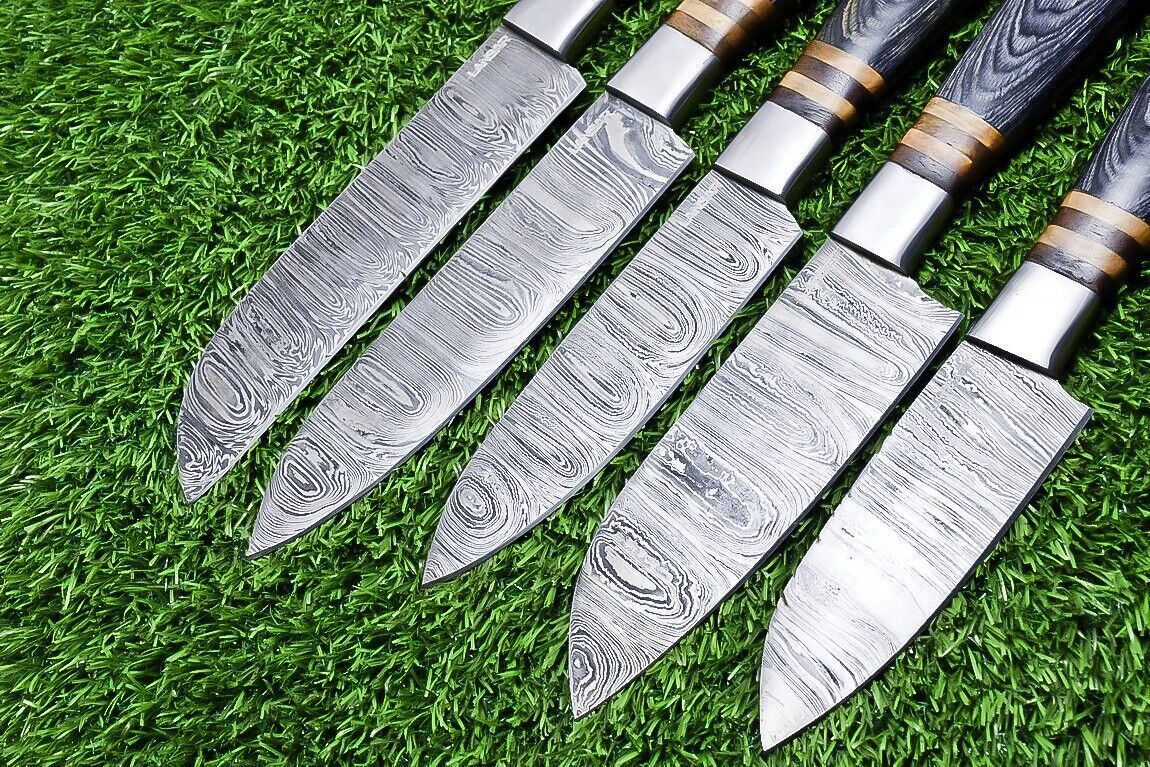 Detail view of the hand forged Damascus steel blade pattern and professional satin finish.