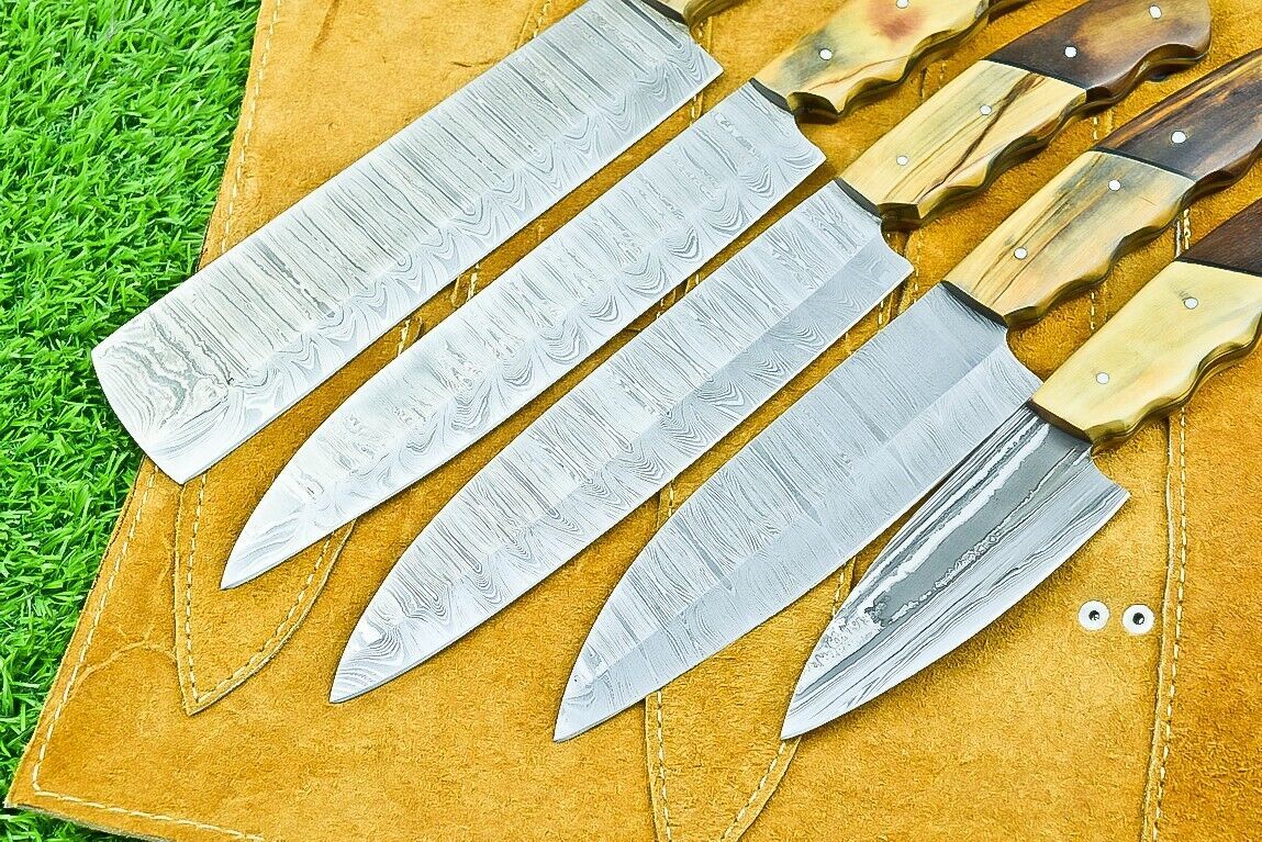 Macro view of the razor sharp satin finish edge on a hand forged 384 layer Damascus steel kitchen knife.