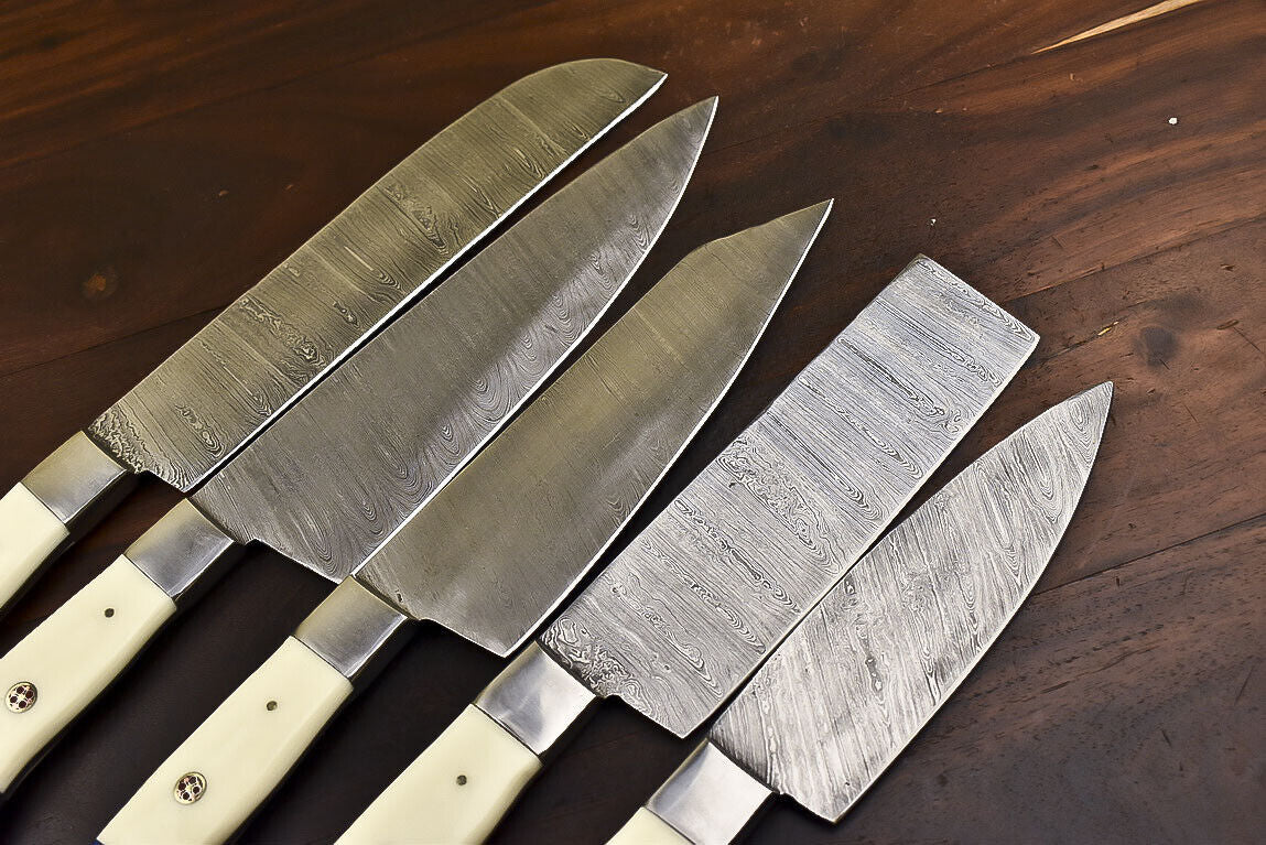 Close up of the hand forged Damascus steel pattern on a custom chef knife blade.