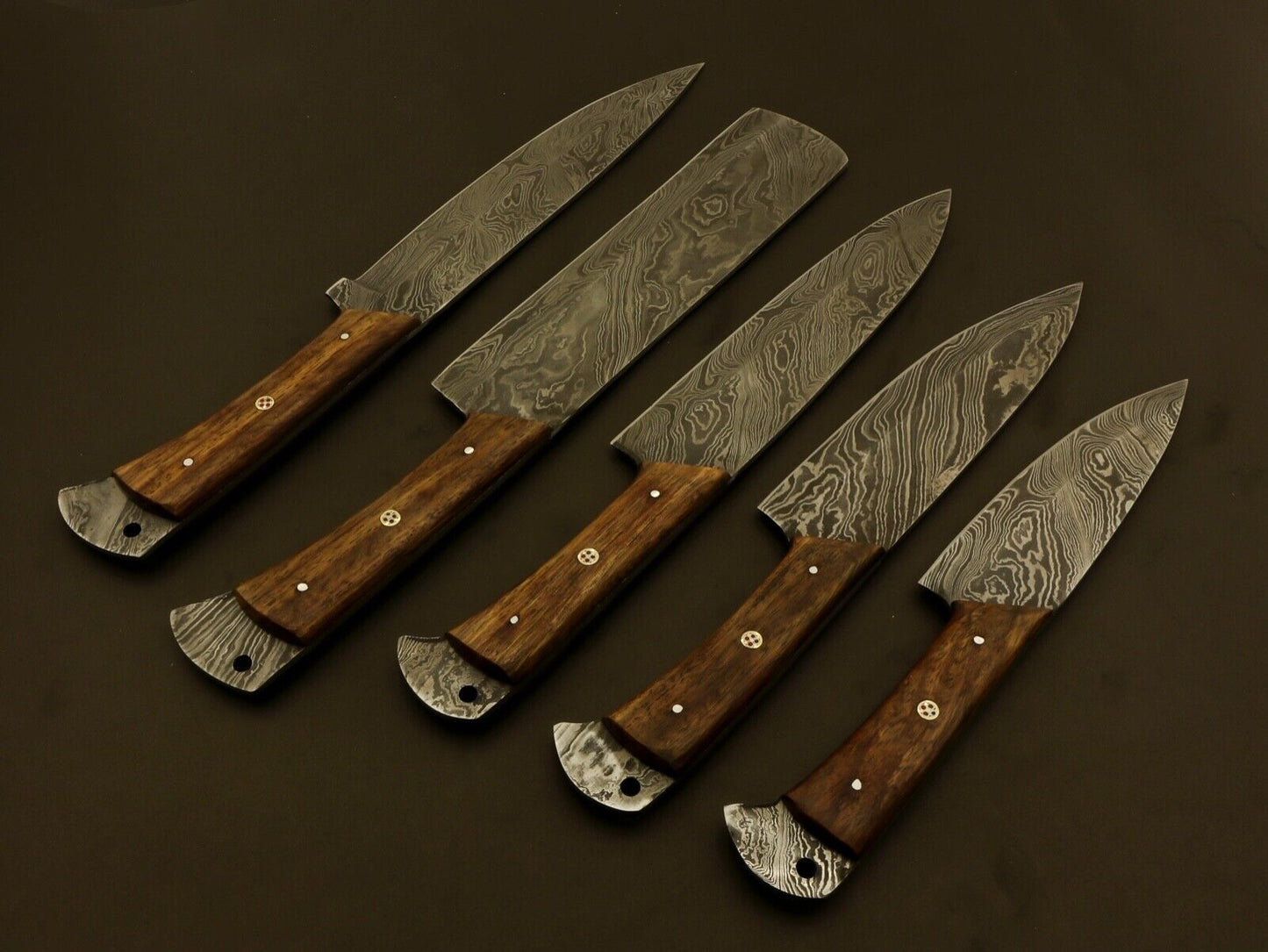Hand forged Damascus steel blade with balanced wood handle, built for professional culinary precision.