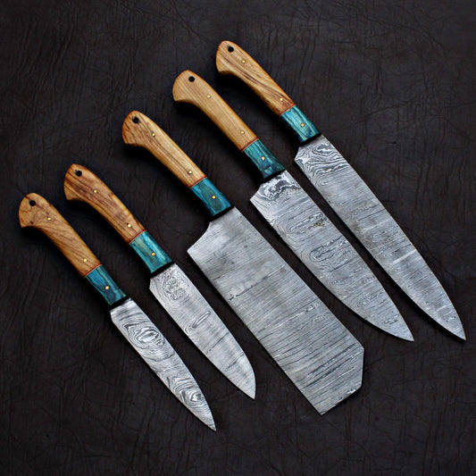5 pieces custom handmade Damascus chef knife set with forged steel blades on a rustic wooden background.