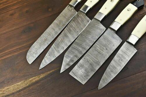 High resolution view of hand forged Damascus steel blade pattern on a professional chef knife.
