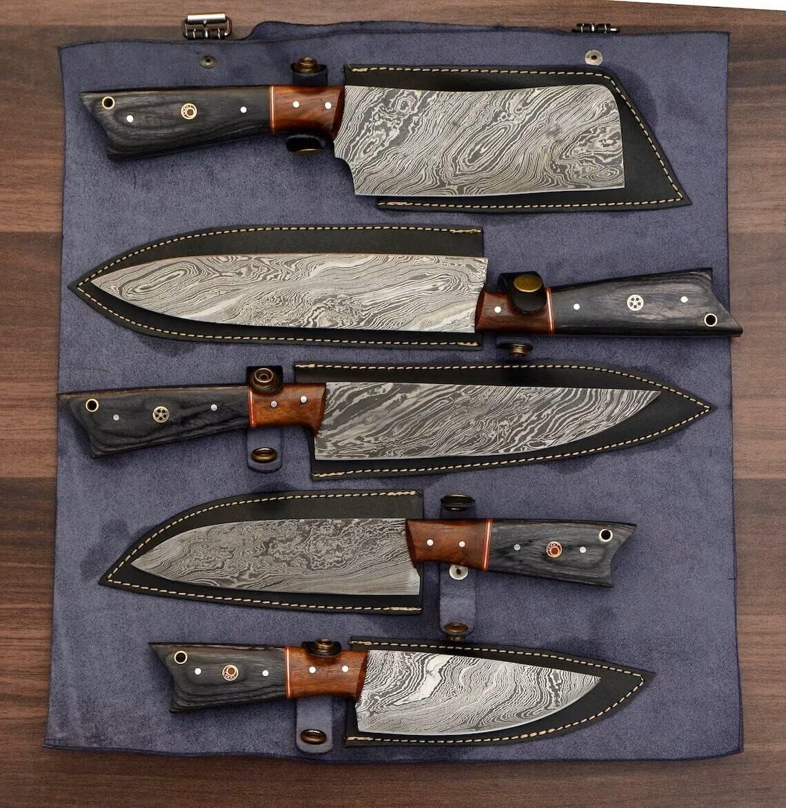 Custom Damascus chef knife set displayed in a professional leather roll, perfect for kitchen storage or travel.