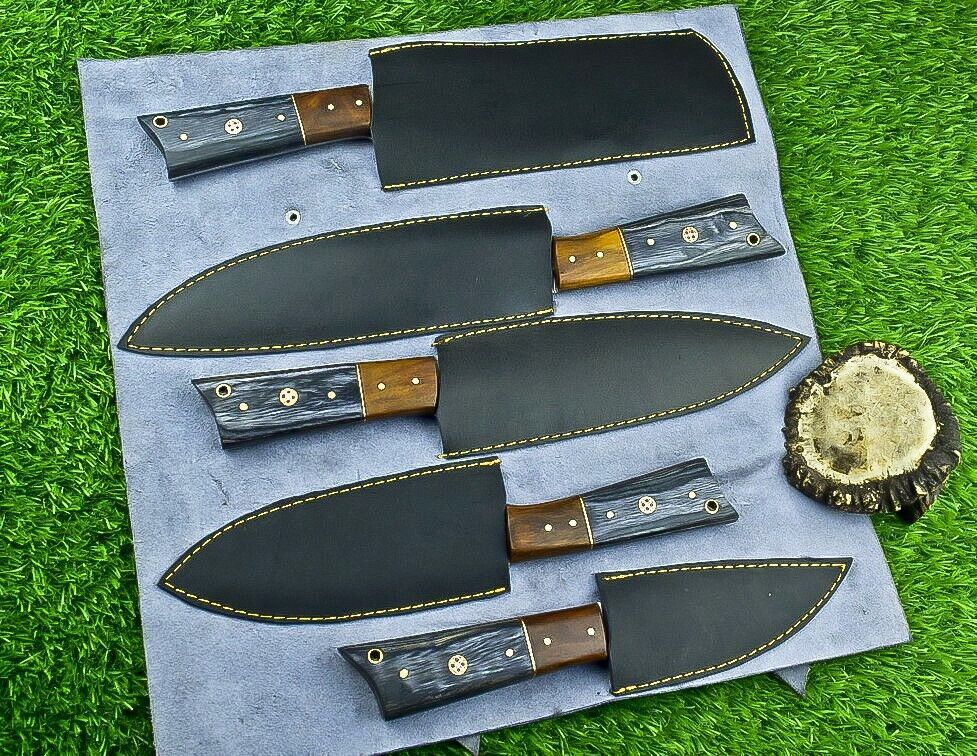 Professional Damascus chef knife set displayed with included hand stitched leather storage roll kit.