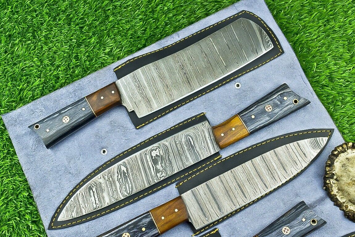 Close up of hand forged Damascus steel chef knife blade showing unique layered pattern and satin finish.
