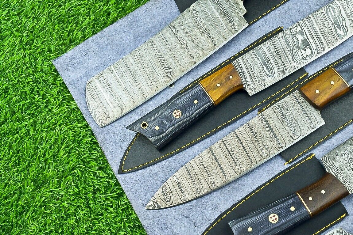 Handheld view of custom chef knife featuring ergonomic natural wood handle with decorative brass mosaic pin.