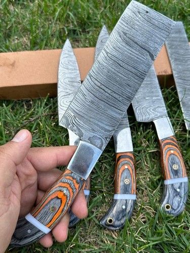 Professional Damascus steel cleaver knife for kitchen prep featuring ergonomic wood handle.