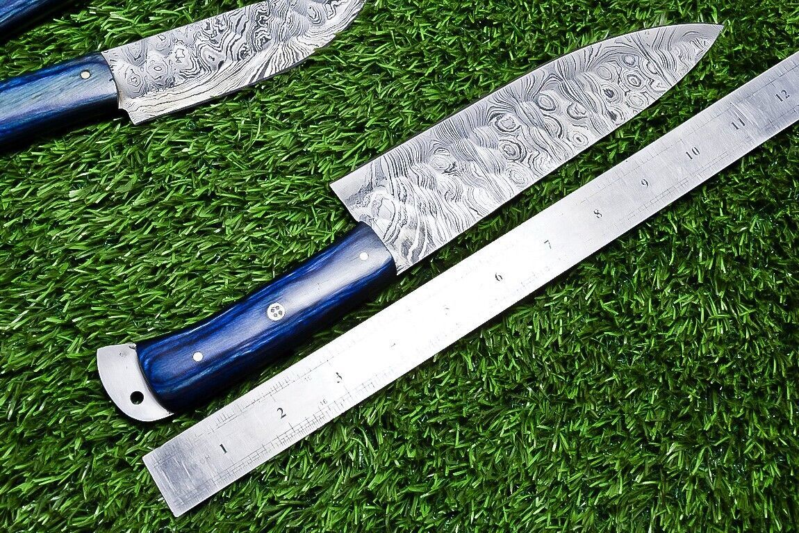 Close up detail of a Damascus steel kitchen knife blade showcasing the unique 384 layer pattern and satin finish.