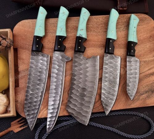 Hand forged Damascus steel cleaver and utility knife set for professional culinary preparation.
