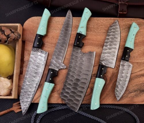 Close up of 8 inch Damascus steel chef knife with 512 layer twisted pattern and ergonomic resin handle.