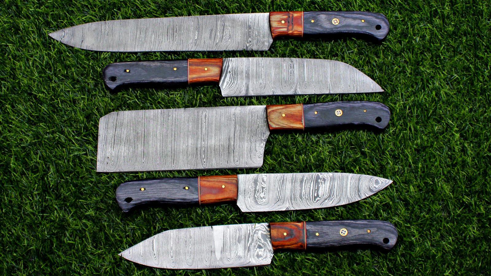Close up of hand forged Damascus steel pattern on a custom chef kitchen knife with satin polish.