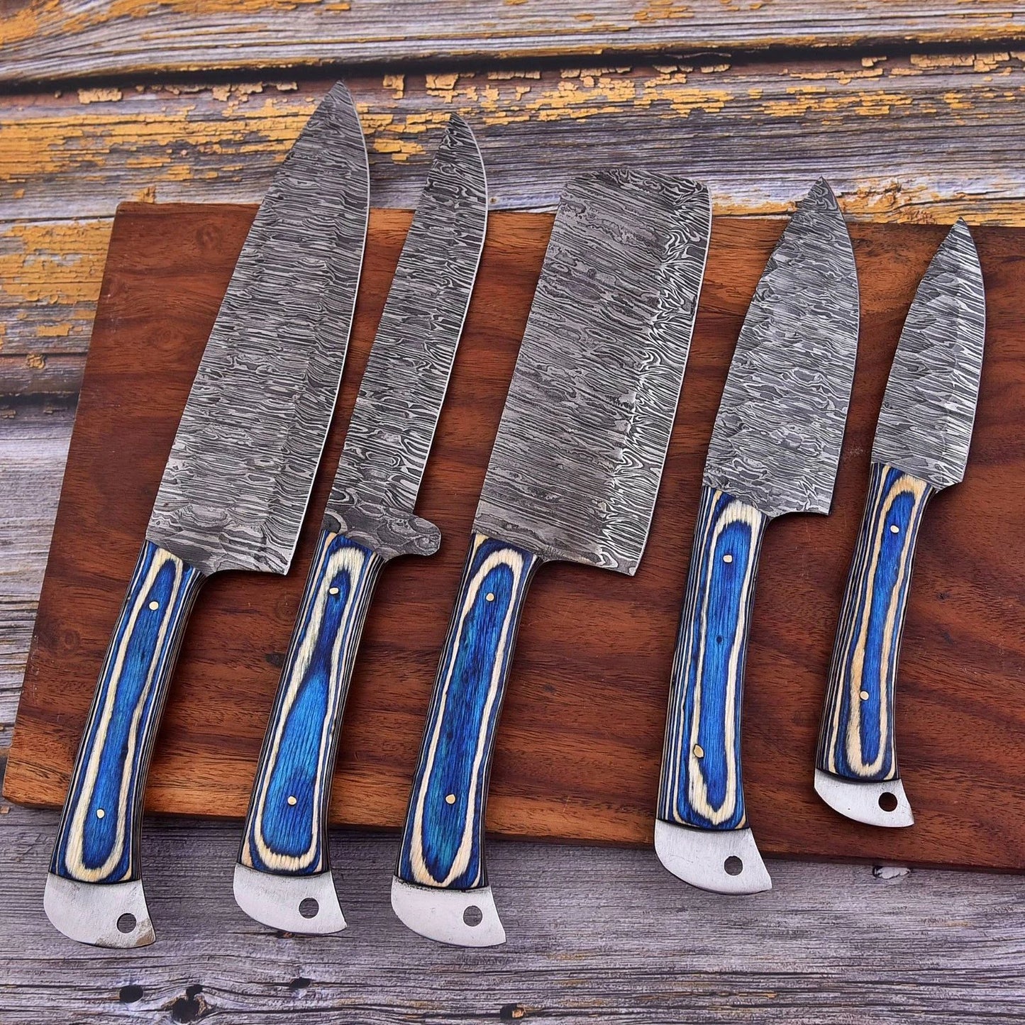 Hand forged 5 pieces Damascus steel kitchen knife set featuring elegant engraved bone handles and decorative mosaic pins.