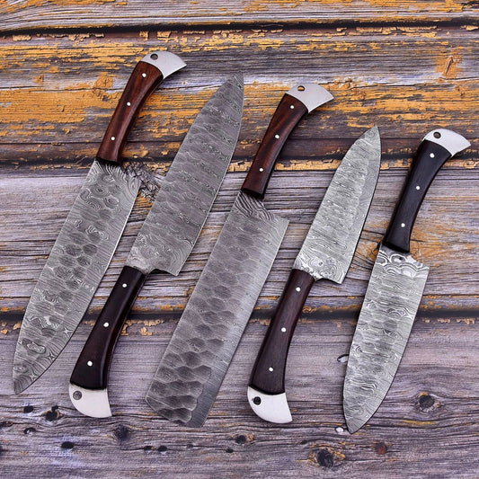 5 pieces custom Damascus steel kitchen knife set featuring hand forged blades and ergonomic wood handles with intricate mosaic pin detailing.