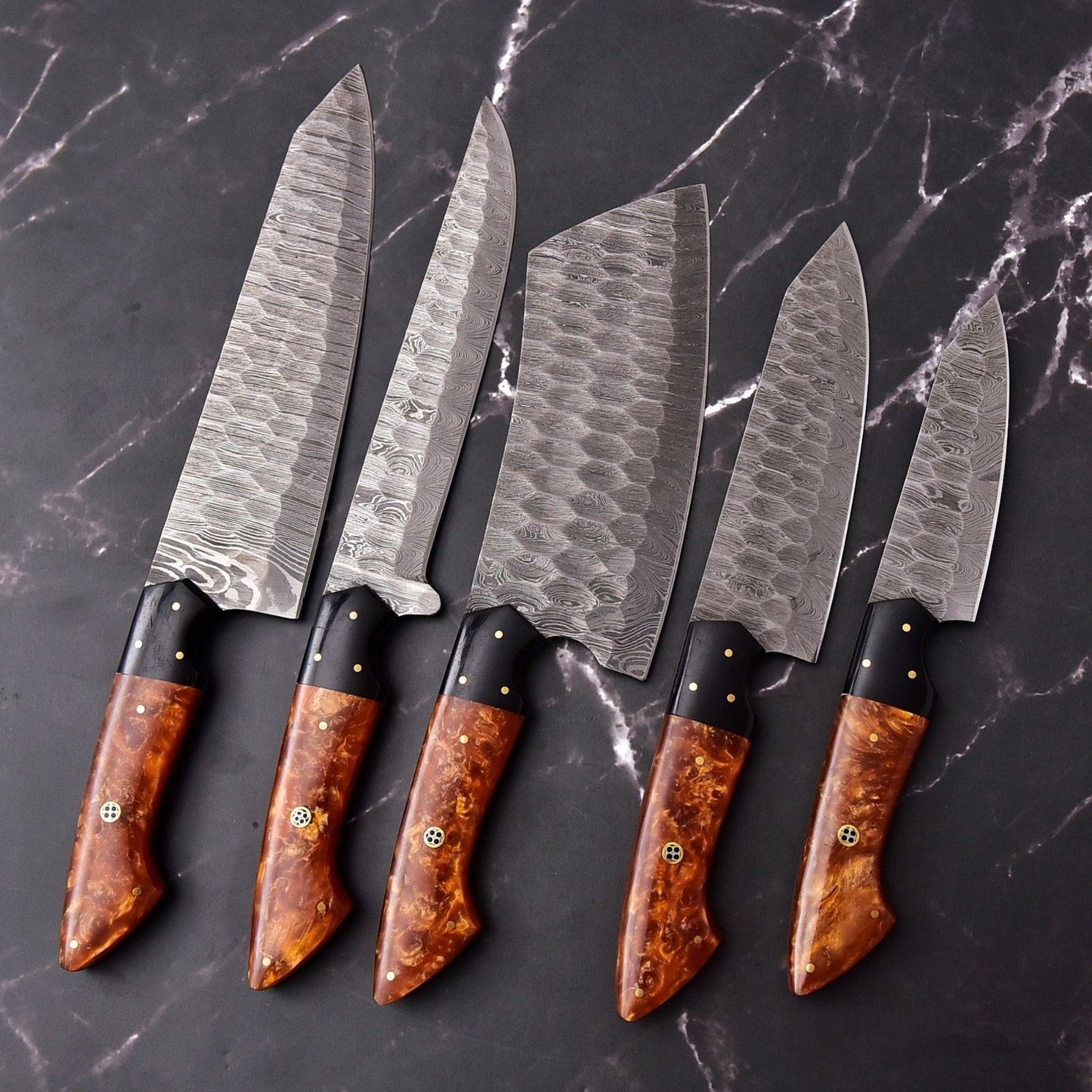 Handmade Damascus chef knife set displayed as a luxury culinary gift for home cooking enthusiasts.