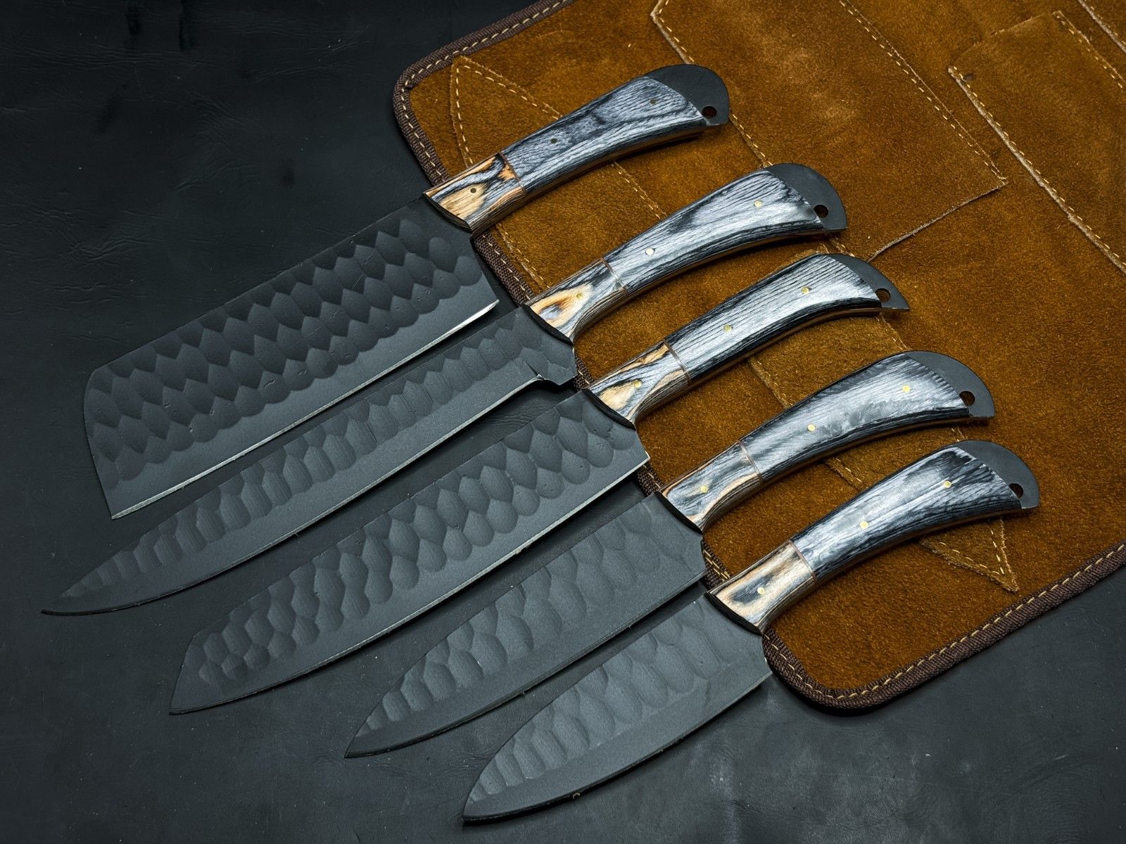 Handmade 5 piece carbon steel kitchen and survival knife set with wood handles and leather sheaths.