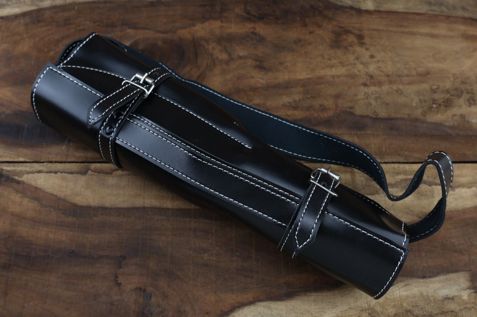Hand stitched leather roll kit containing a 5 pieces handmade Damascus steel chef knife set with premium olive wood handles.