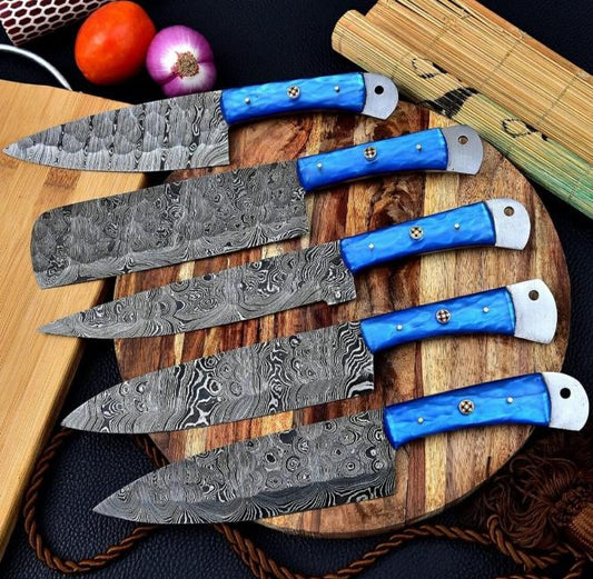 Handmade 5 pieces Damascus steel chef knife set featuring vibrant blue resin handles and protective leather sheaths.