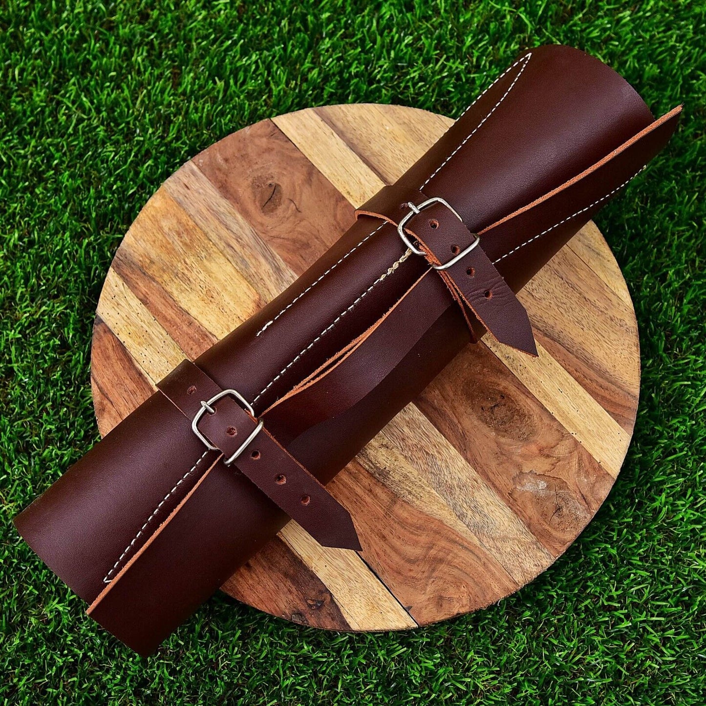 Hand stitched leather roll kit containing a 5 pieces custom Damascus steel chef knife set for professional storage and travel.