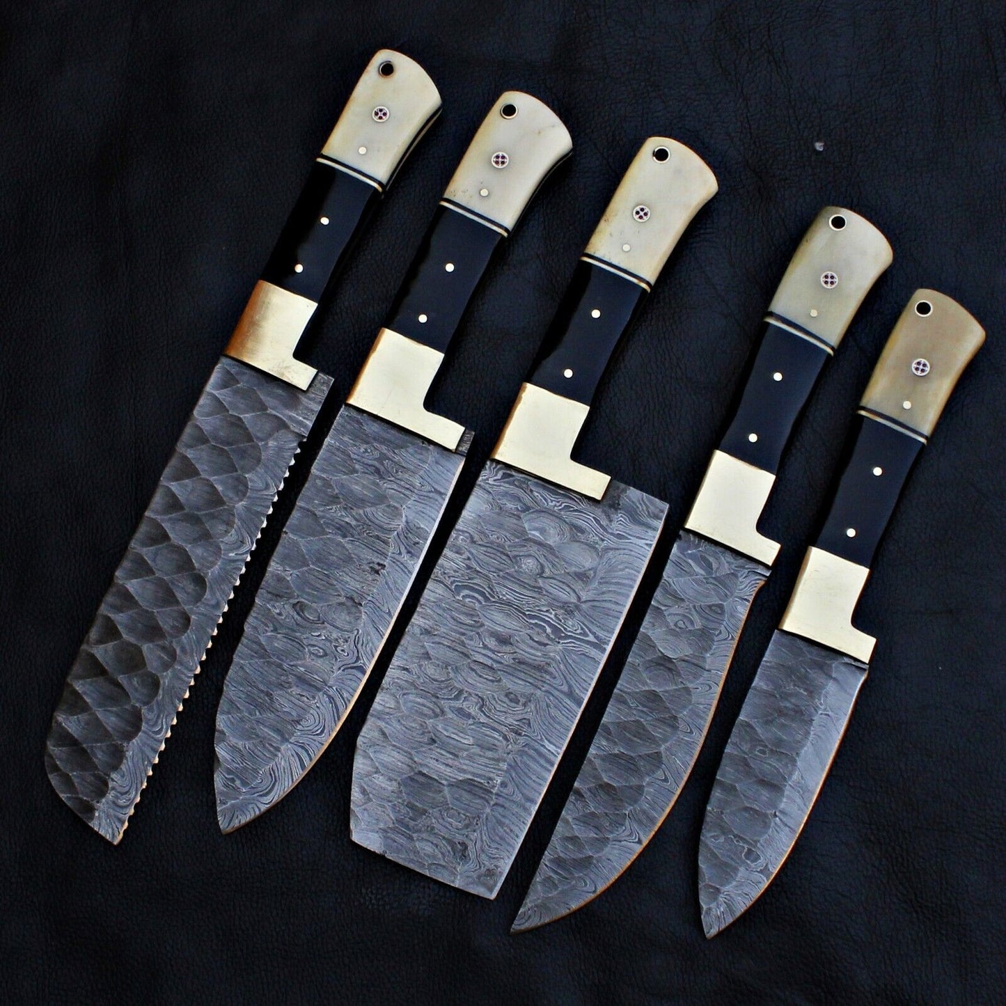 Close up of the unique, hand forged Damascus steel pattern on a professional chef knife.