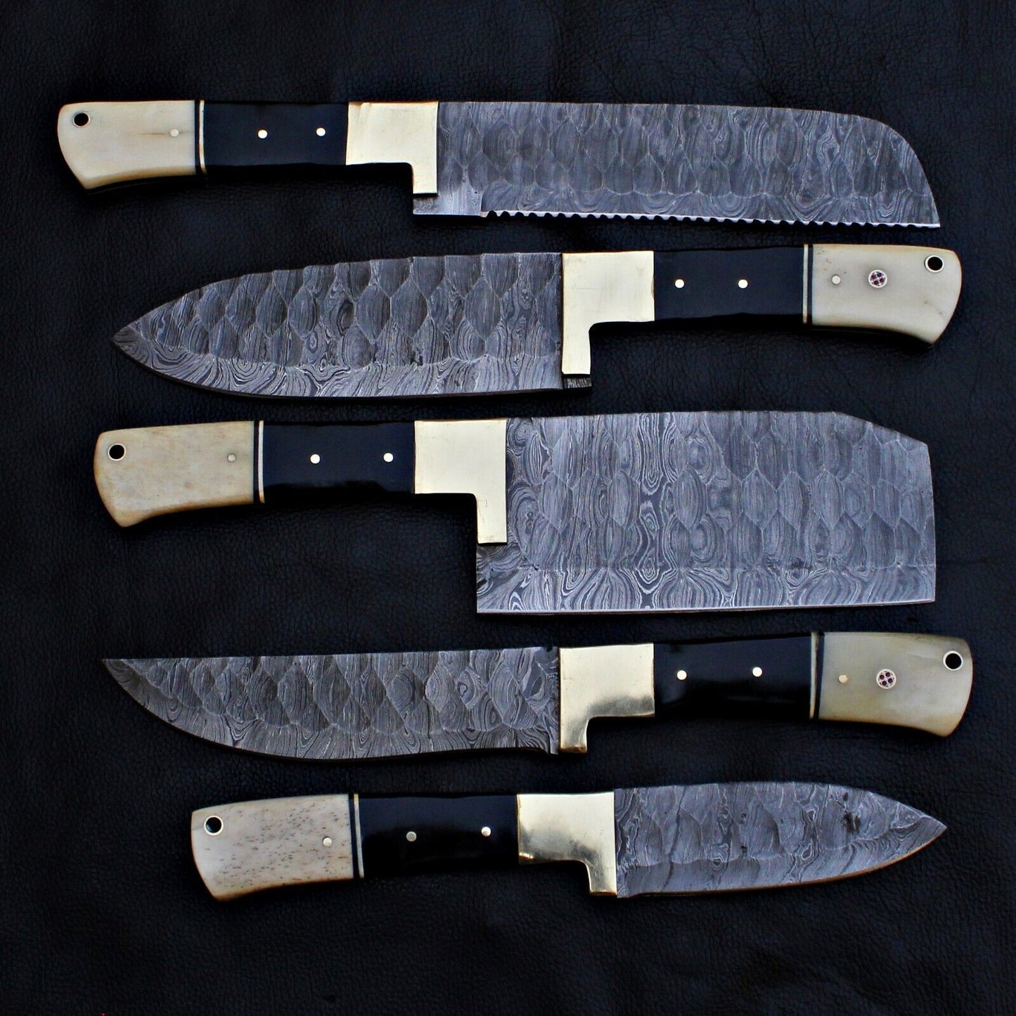 Top down layout of the 5 pieces professional Damascus steel chef knife collection.