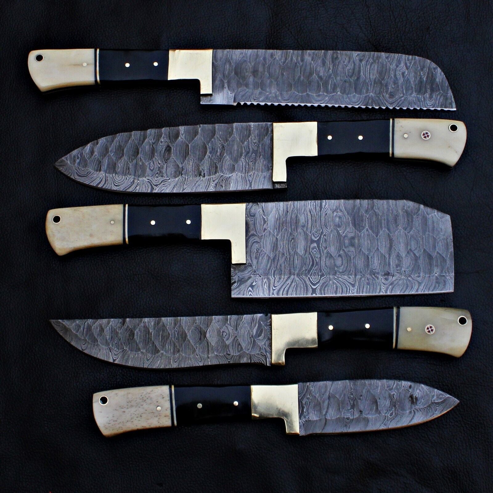 Top down layout of the 5 pieces professional Damascus steel chef knife collection.