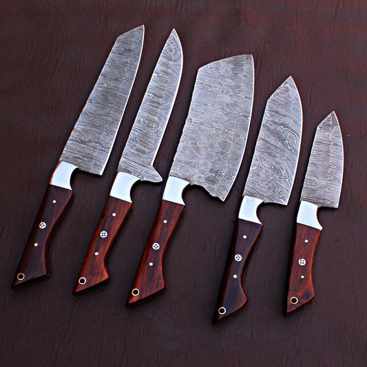 5 pieces custom handmade Damascus chef knife set featuring forged steel blades and unique custom handles on a rustic wood background.