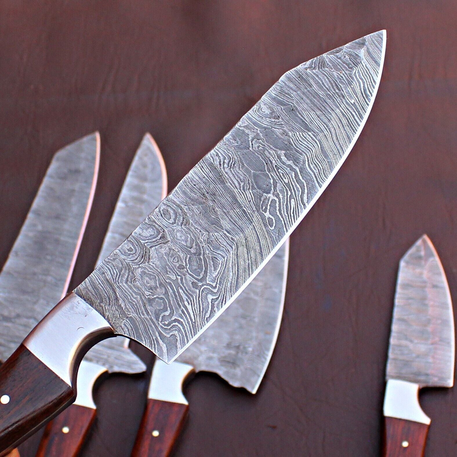 Custom handmade Damascus chef knife performing precision cutting, demonstrating the sharpness and balance of forged steel.
