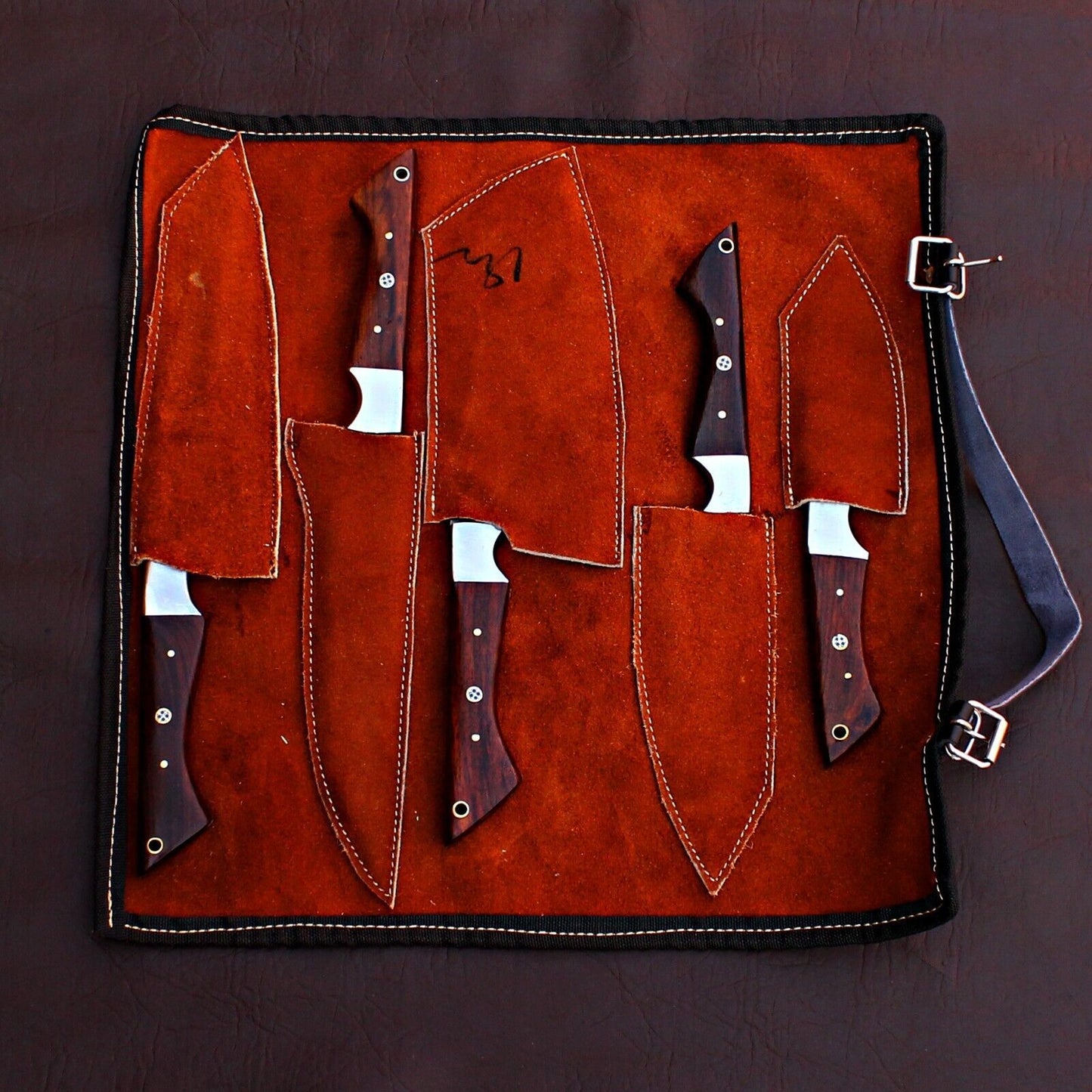 Top down layout of the 5 pieces Damascus kitchen knife set, showing the consistent design and authentic forged steel textures.