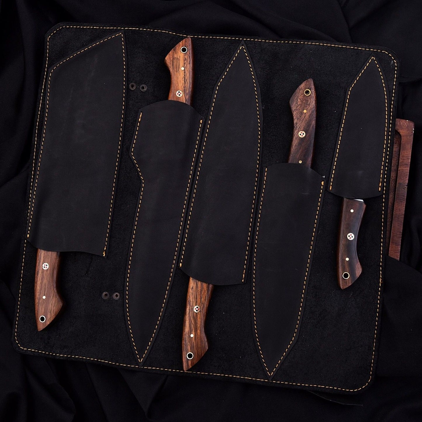Premium leather sheath included with handmade Damascus kitchen knife set for safe and elegant storage.