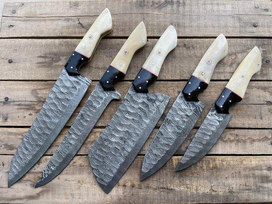5 pieces custom handmade Damascus chef knife set displayed on a wooden surface, featuring premium Damascus steel blades and ergonomic handles
