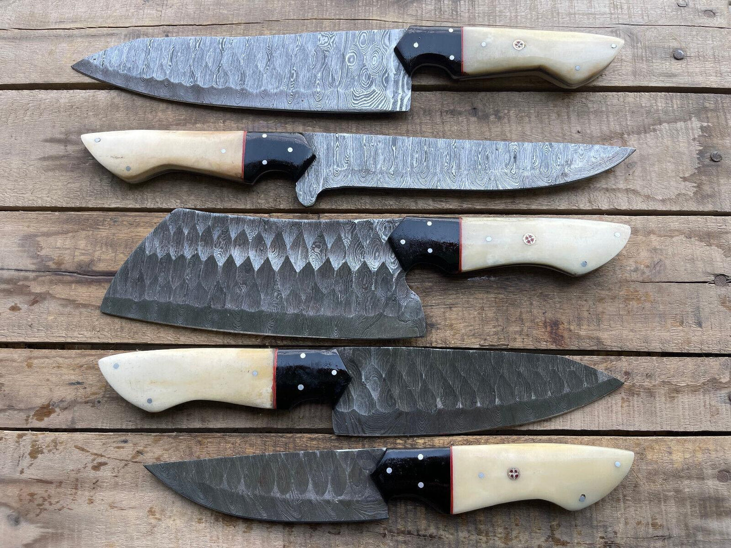 A professional grade Damascus kitchen knife set for chefs, featuring five distinct custom handmade knives for culinary precision and cutting.