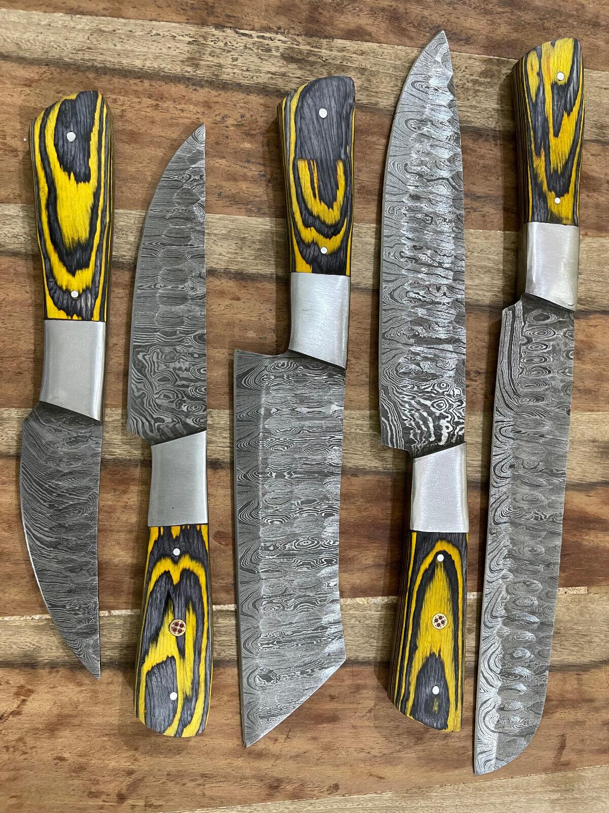 Professional chef using a Damascus steel kitchen knife for precision cutting in a modern home kitchen.