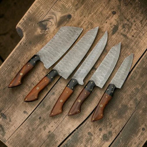 Professional 5 pcs Damascus steel chef knife set laid out flat on a wooden texture