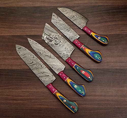 Full lineup of Damascus steel blades with rainbow acrylic handles on a wood table