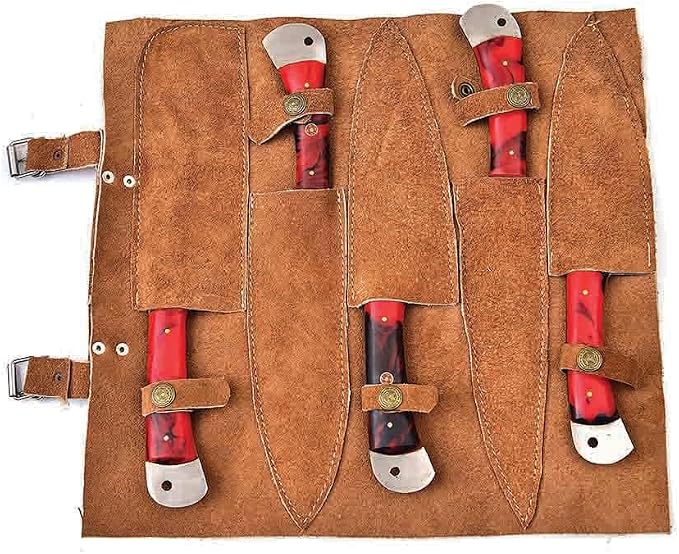 Open leather roll case showing sheaths for each Damascus knife