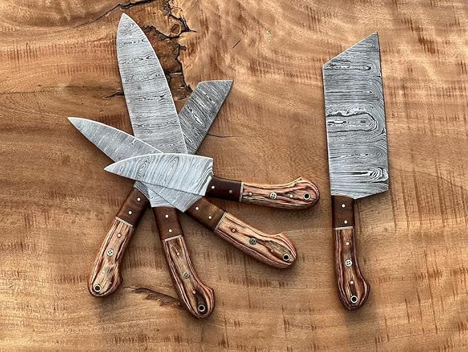 5 pieces Damascus knives with wood handles crossed on wood board