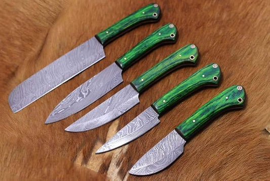 Close up of Damascus steel blades and green marbled handles with red and white star mosaic pins
