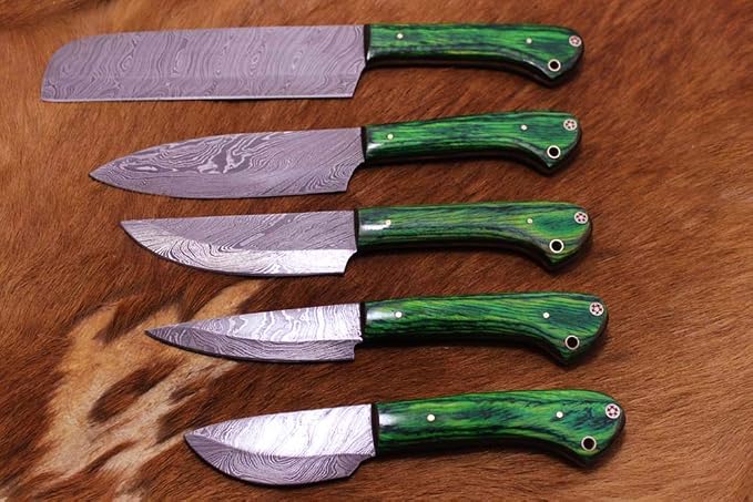 5 piece Damascus steel knife set unsheathed with green marbled wood handles lined up on brown fur