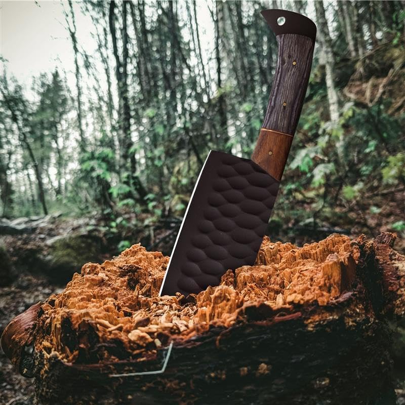 Damascus steel cleaver from the 5 piece set planted in a wood log outdoors