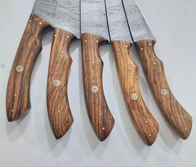 Close up of wood knife handles with brass pins