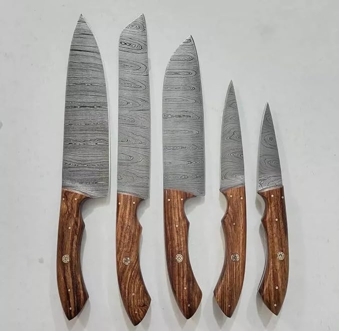 5 piece Damascus knife set with wood handles on white background