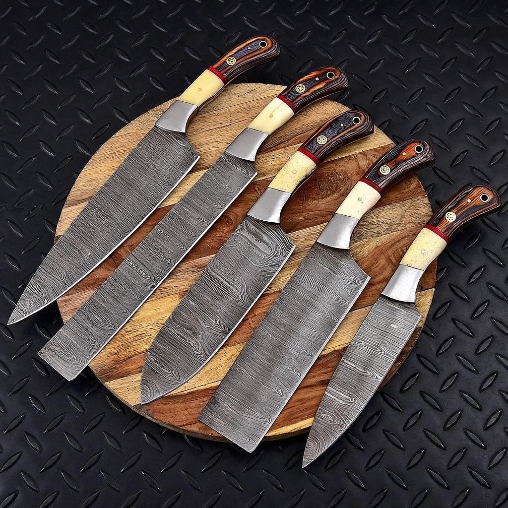 Hand forged 5 pieces Damascus steel chef knife set with leather sheath displayed on rustic timber.